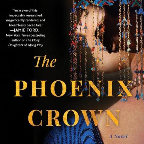 Cover of "The Phoenix Crown" by Kate Quinn & Janie Chang.  Gold text over a woman in profile wearing a blue dress and elaborate veil, against a black background.
