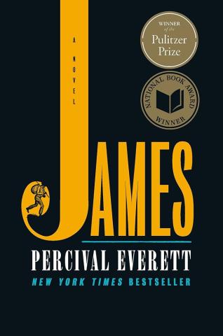 Book Cover, black background. The word James is written in oversized bold gold font, covering the majority of the cover.  Within the curve of the J, an image of a man with a knapsack is visible.  Round awards for both the Pulitzer Prize and the National Book Award Winner are on the top right corner. 