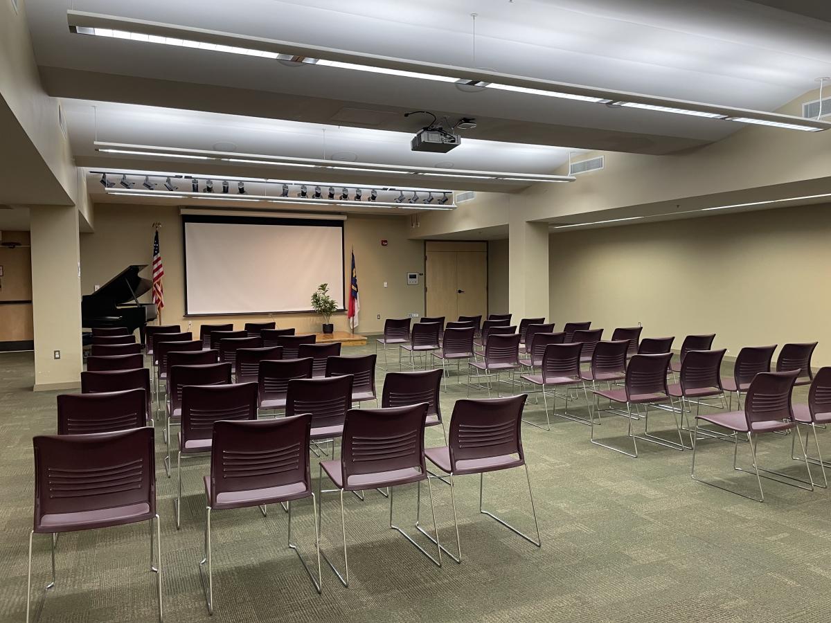 meeting room with chairs and carpet